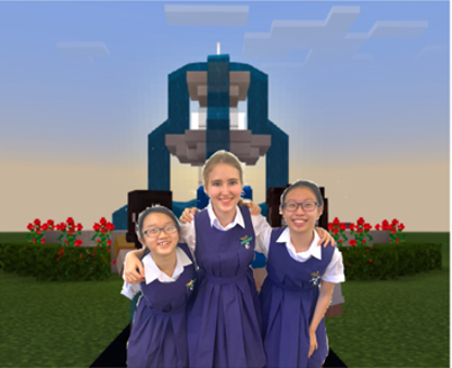 Photograph of Team Futurae members: (L to R) Hilary Chee, Anastasiya Samushkova, Zhang Haiyun in front of a Minecraft background
