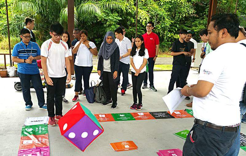 ITE students visiting the Pulau Ubin Micro-grid Test-bed taking part in a game to learn more about Singapore’s renewable energy landscape.